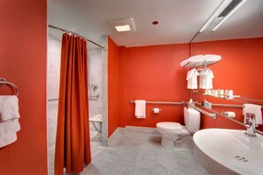 Eclectic and stylish bathroom, complete with striking fixtures and vibrant decor, ensuring a lively and refreshing environment.