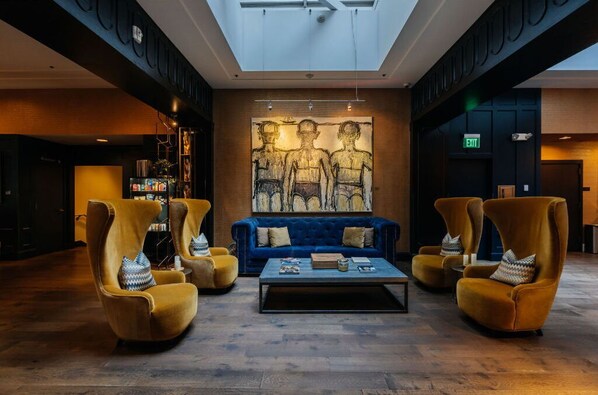 Enjoy the stylish ambiance of our lobby with its striking art pieces and unique mustard swirl chairs that make every moment of your stay memorable.