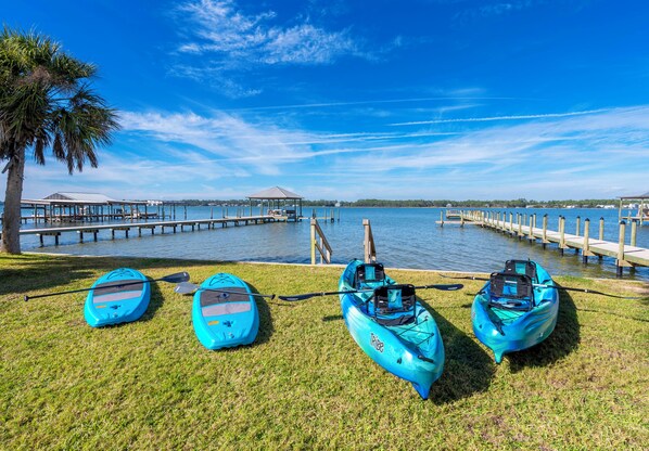 Waterfront retreat with kayaks, paddleboards, and serene adventure views.