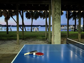 Play outdoor ping-pong with a stunning bayside view—perfect for family fun!