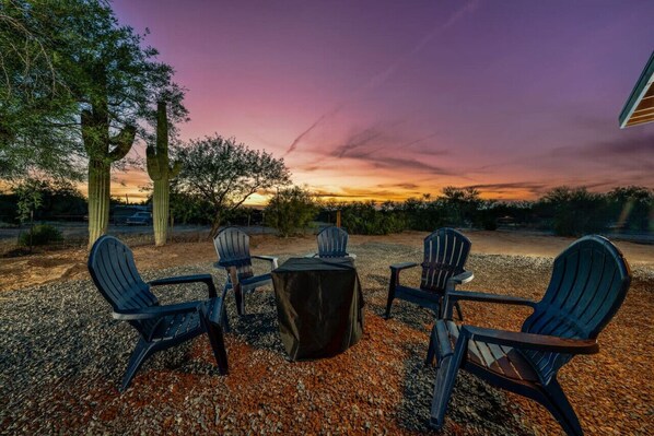 Backyard with fire pit, seating and grill, perfect for watching Tucson sunsets