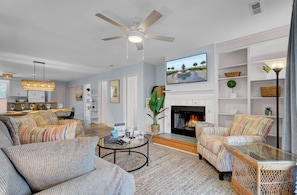 Cozy living room with a fireplace and TV.