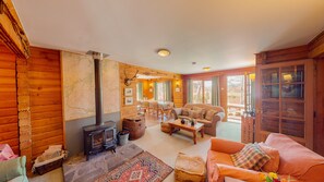 The spacious living area with log burner