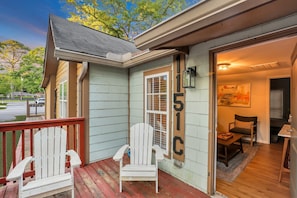 Welcome to your vacation home. You'll be greeted by one of several outdoor seating areas.