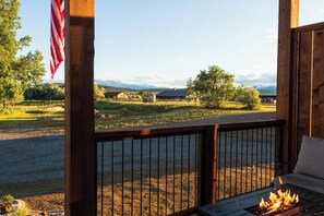 Mountain and countryside views abound from the front deck. Note: Pergola and wild flower meadow coming in summer 2025!