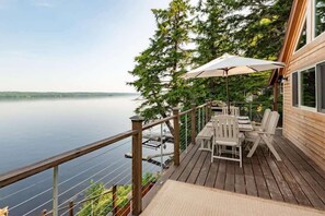 **Deck Overlooking the Lake**: "Enjoy your morning coffee or evening dinner on our deck, offering unparalleled views of the tranquil lake and surrounding nature.