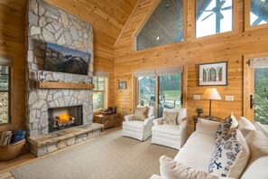 The cozy living area with gas log fireplace will seat all your guests.