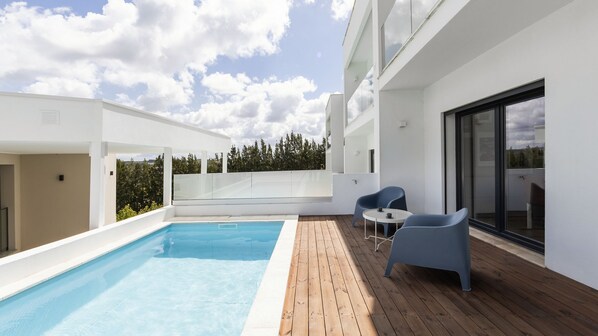 Lovely outdoor pool with seating area for great moments in the sun. #Pool #Lovely
