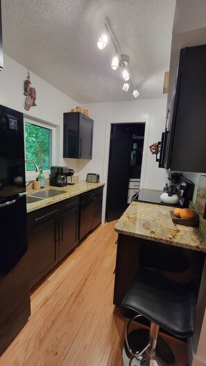 All-new kitchen with Calphalon nonstick cookware, large microwave, & full oven.