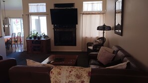 Family room with leather sectional & leather recliner.  Smart TV and DVD player