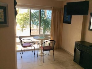 table for two, pool and beach view