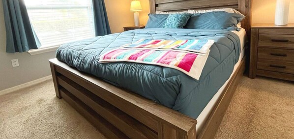 Relax in a spacious king bed with your own TV and private bathroom for ultimate comfort.