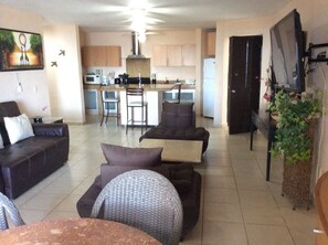 living and kichen, right side entrance to this apartment