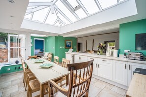 Myrtle Cottage, Friston: Dining area with doors leading to the rear, terraced garden