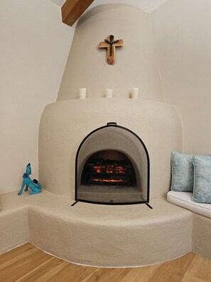 Remote controlled Electric fireplace has realistic flames and crackling sounds. 
