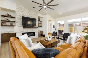 Spacious living room with comfortable furniture for everyone to gather.