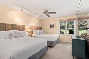 The bedroom area offers 2 queen beds and an accordion door for privacy should you need this.