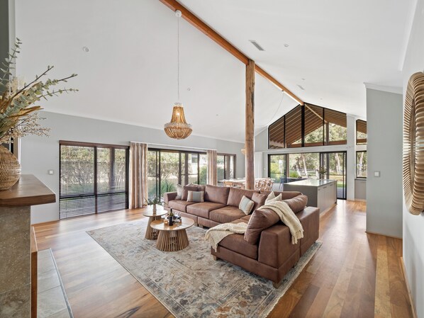 Bright and airy, this spacious living area seamlessly connects to the dining and kitchen, creating the perfect space for entertaining.