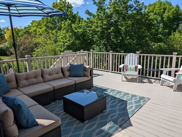 Relax on the huge deck under the umbrella.