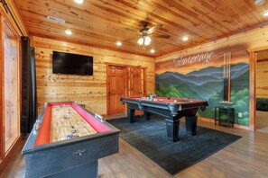 Fun-filled game room equipped with air hockey and a pool table.
