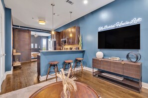 Step into a stylish and cozy living room where industrial charm meets modern sophistication.