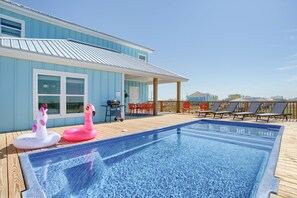 Sparkling private pool on the back deck, with floats for use in the pool closet