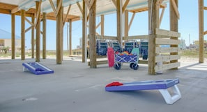 Beach gear for enjoying a fun day at the beach! Wagon, chairs, toys, & cornhole