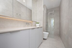 Well-equipped bathroom with shower