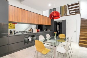 The kitchen features an extra wide oven, five-burner gas stove, rice cooker and a walk-in pantry area. 
