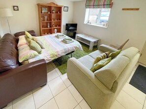 Living room with sofa bed | Lily Pad 5 - Lily Pad Cottages, Nassington, near Stamford