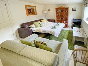 Living room with sofa bed | Lily Pad 5 - Lily Pad Cottages, Nassington, near Stamford