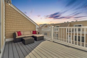Relax and watch the sunset on our expansive balcony