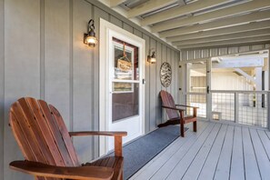 Seating for two on the covered portion of the front porch