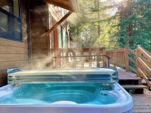 Soak in the hot tub, surrounded by the peaceful whispers of the forest.