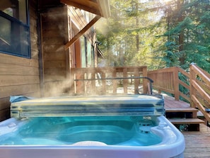 Soak in the hot tub, surrounded by the peaceful whispers of the forest.