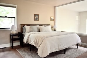 Revel in comfort in the primary bedroom equipped with a king bed, located upstairs.