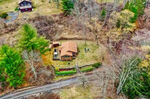 Bird's eye view of Grandview Cabin with rock walls and open deck.