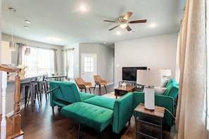 All couches in our place are futons. Simply unzip the back and pull the support legs out when using as a futon.