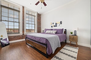 Both bedrooms feature king-sized beds, floor-to-ceiling windows, and ample space – comfort meets style in downtown Johnson City.