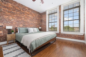 Wake up to city views! This spacious bedroom with a king bed is the perfect place to rest and recharge.