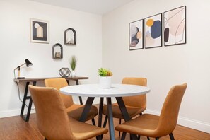 The open dining space seamlessly blends with the loft’s modern design – perfect for both casual meals and special occasions.