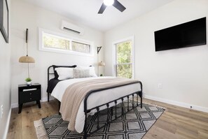 The spacious bedroom is the perfect place to unwind after a long day.