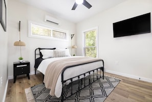 The spacious bedroom is the perfect place to unwind after a long day.