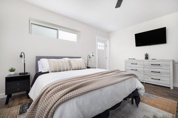 Designed for comfort and relaxation, this bed features fresh linens.