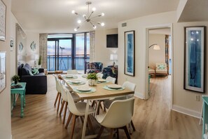 Dining table for 8 guests with additional 4 seats at the kitchen island.