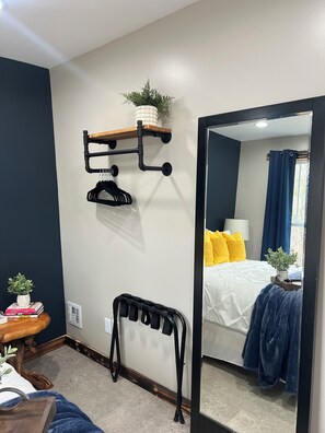 Bedroom includes an open-concept closet, perfect for this cozy space. 