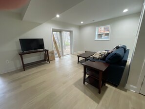 Basement Rec room with smart tv. Ping Pong Table included and not pictured.
