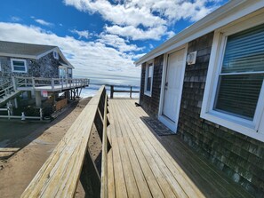 Lofted entrance with shared lot space with neighboring properties.