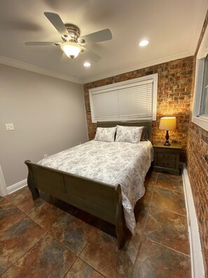 Queen bed in room 2 with closet clothes storage