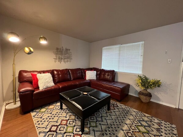Kick back and relax on this comfy. Great space to read a book or watch a movie on our 55 inch smart TV.